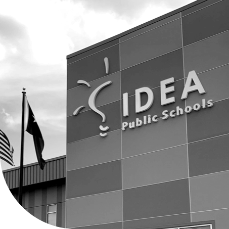 IDEA Public Schools building front with flagpole